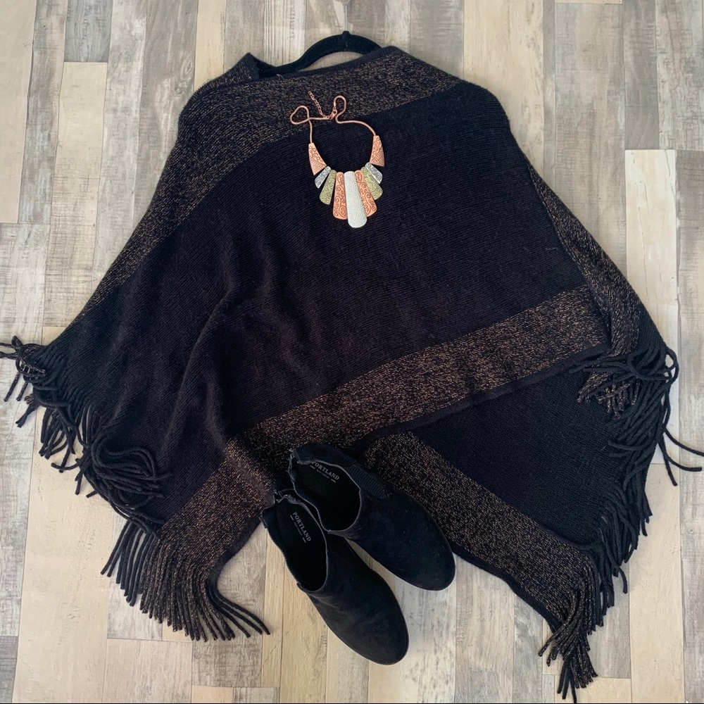Soft asymmetrical poncho with fringe
